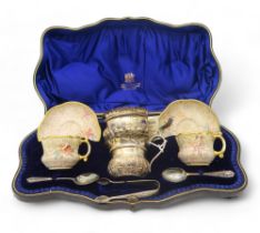 A matched silver and porcelain tea for two set, the sauce boat and sugar bowl by Josiah Williams &