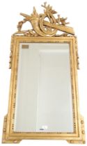 A 20th century regency style gilt framed bevelled glass wall mirror, 134cm high x 62cm wide
