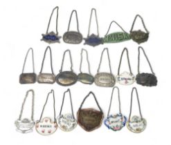 A collection of ceramic, plate and silver decanter labels, two silver whisky examples, one by B &