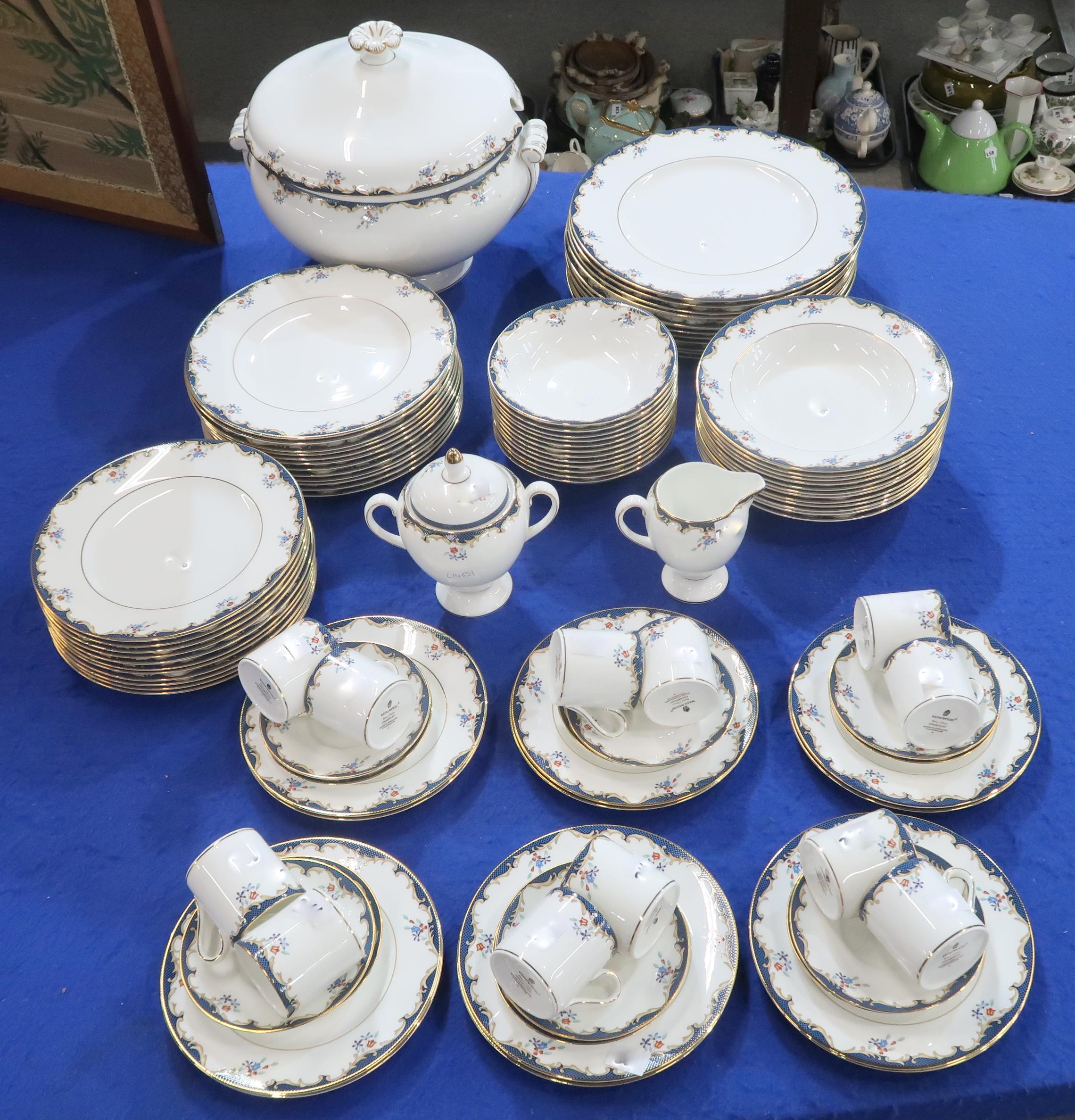 A Wedgwood Chartley pattern dinner service for twelve comprising plates, bowls, coffee cups and