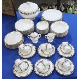 A Wedgwood Chartley pattern dinner service for twelve comprising plates, bowls, coffee cups and