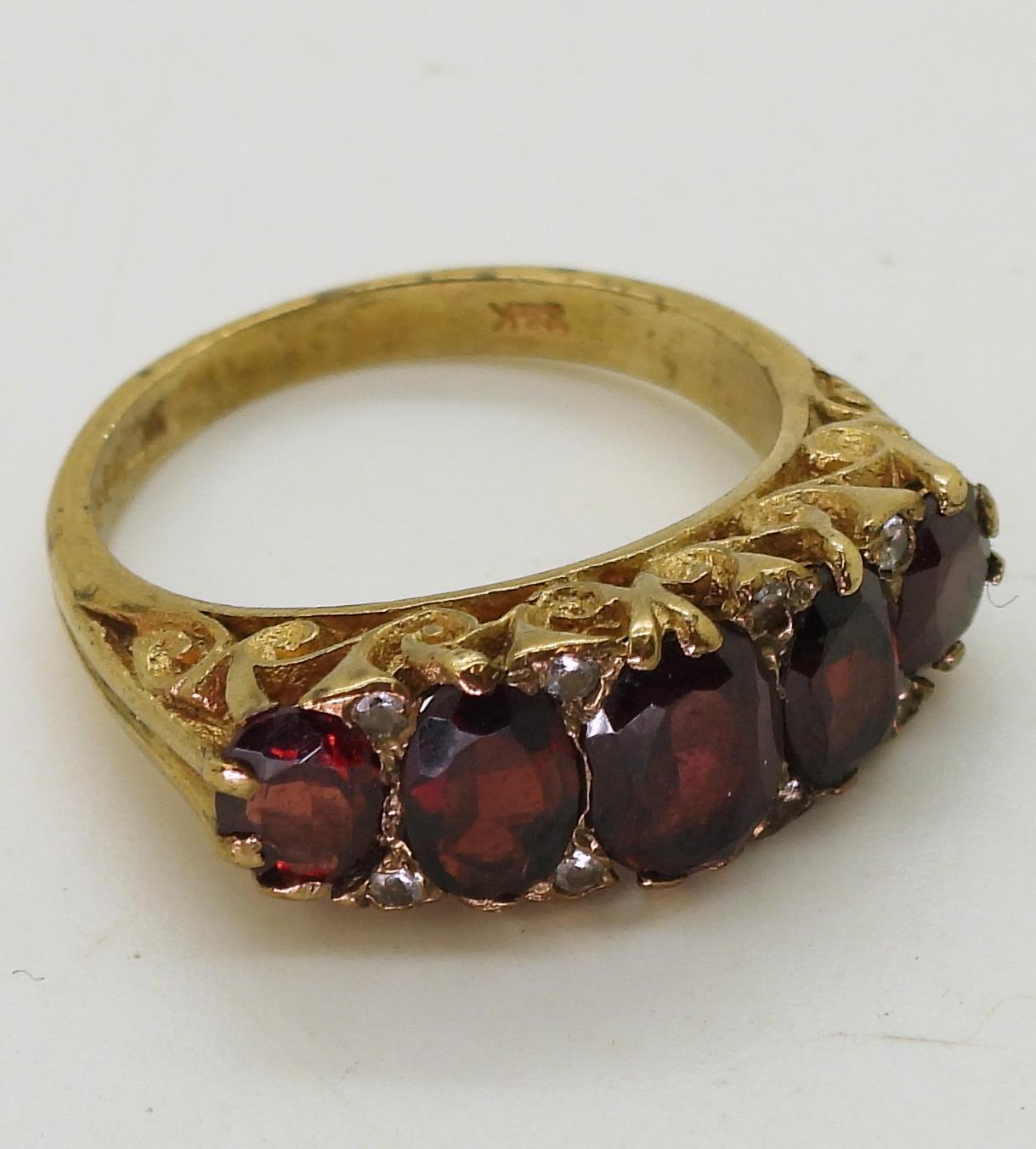 A 9ct gold garnet five stone classic scroll ring with diamond accents, size M1/2 weight 4.3gms - Image 2 of 2