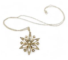 A 9ct gold pearl flower pendant with a 9ct gold rope chain, weight 3.9gms Condition Report:was a