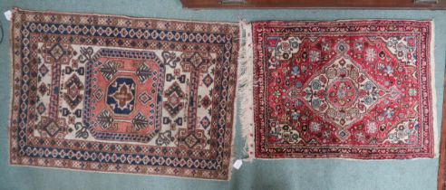 A lot of two rugs consisting beige ground Balouch style rug with geometric medallion and