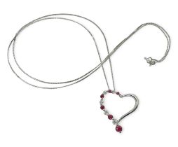 A 9ct white gold ruby and diamond heart pendant, set with estimated approx 0.15cts of brilliant