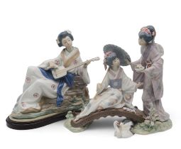 Lladro figure group, Springtime In Japan,  modelled as two Geisha on a bridge with a crane, sculpted