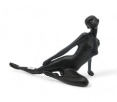 A contemporary bronzed metal figure of a girl in reclining pose Condition Report:Available upon