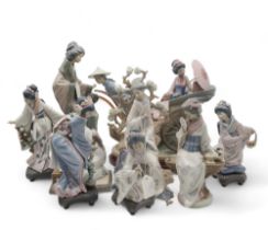 A collection of Lladro figures including Rickshaw Rise, Geisha arranging flowers, and other geisha