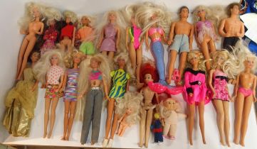 A collection of vintage Barbie dolls, mostly 1990s/00s-era, together with a small collection of