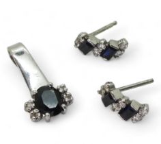A 9ct white gold sapphire and diamond pendant with similar earrings, weight together 2.5gms