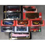 An assortment of boxed 1:18 and 1:24-scale diecast model vehicles, with makers t include Burago,