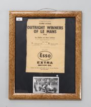 A framed Esso Extra Motor Oil advertisement congratulating Ecurie Ecosse, Outright Winners of Le
