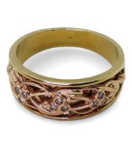 A 9ct gold 'Clogau Gold' ring 'Cariad Am Byth - Beloved forever' pattern set with nine diamonds
