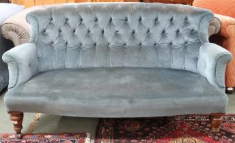 A Victorian blue buttonback upholstered two seater settee on turned front supports terminating in