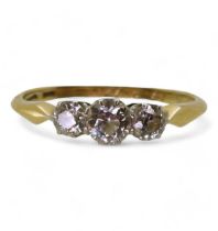 An 18ct gold three stone diamond ring, set with estimated 0.50cts, size M, weight 2gms Condition