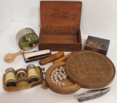 A miniature solitaire board, miniature brass spirit level in treen case, cased cheroot holder, opera