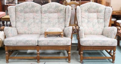A 20th century Ercol elm and beech framed suite comprising two seater settee, 110cm high x 140cm