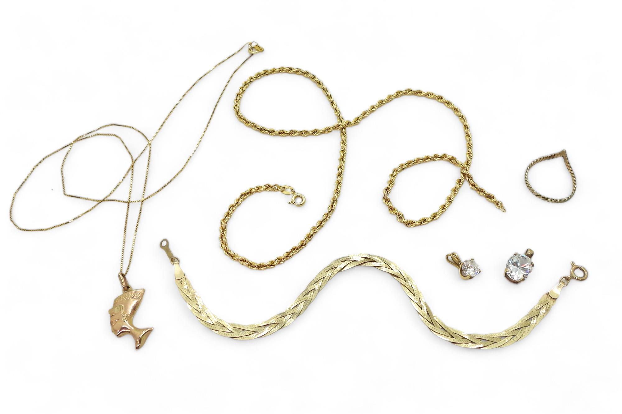 A collection of gold and yellow metal to include a braided 9ct bracelet, 9ct rope chain a