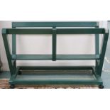 A 20th century green painted freestanding folio stand, 73cm high x 112cm wide x 49cm deep