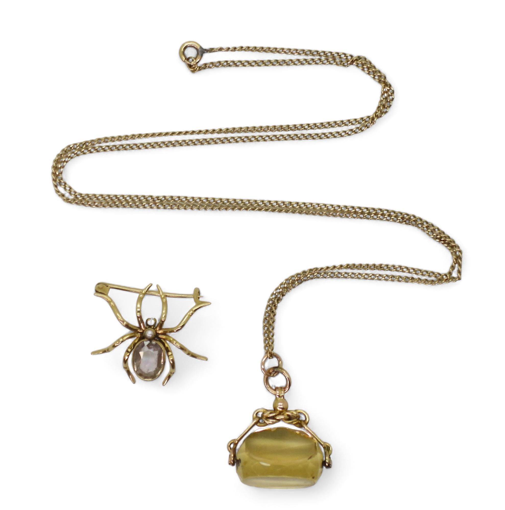 A yellow metal amethyst spider brooch, together with a 9ct gold citrine fob seal (af) and 68cm