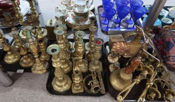 A collection of brass candlesticks including bullseye good luck examples, Diamond princess and other