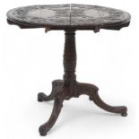 A 19th century stained oak Jacobean style carved drop end table with extensively carved circular top