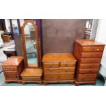 A 20th century stained pine bedroom suite comprising six drawer tall chest, 118cm high x 58cm wide x