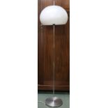 A 20th century after Guzzini standard lamp with domed acrylic shade on chromed upright with circular