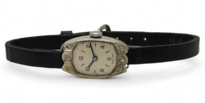 An 18ct white gold ladies cocktail watch with London hallmarks for 1929, engraved case and set
