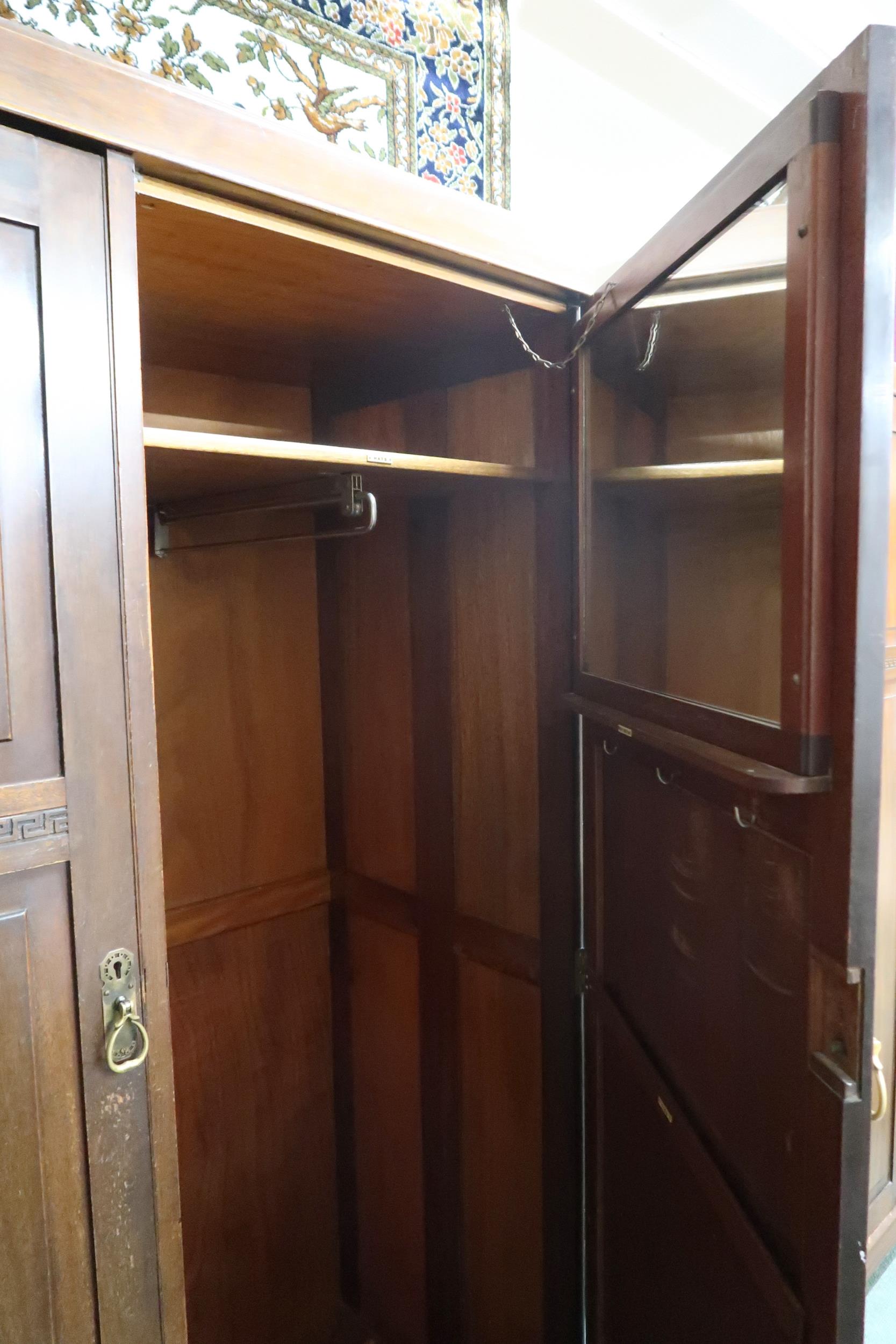 An early 20th century mahogany compactum wardrobe with pair of doors carved with Grecian key - Image 3 of 3