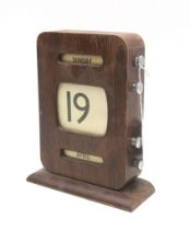 A mid-20th century stained oak perpetual desk calendar, measuring approx. 19cm in height Condition