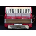 A HOHNER TANGO II M 96 bass  37 key piano accordion in red with case Condition Report:Available upon