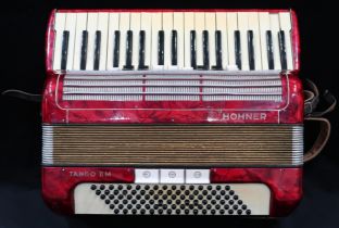 A HOHNER TANGO II M 96 bass  37 key piano accordion in red with case Condition Report:Available upon