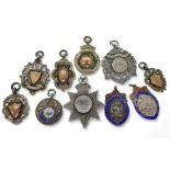 Various silver award medallions to include a Scots Guard example dated 1889, A further enamelled