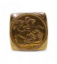 A Gents yellow metal ring, set with a 1910 full gold sovereign, size W1/2, weight 48.1gms