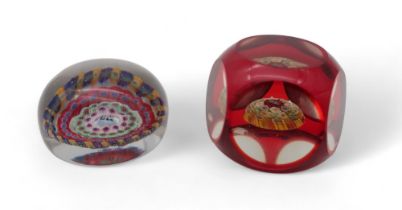 A millefiori paperweight dated 1854, possibly Baccarat, together with another paperweight also dated