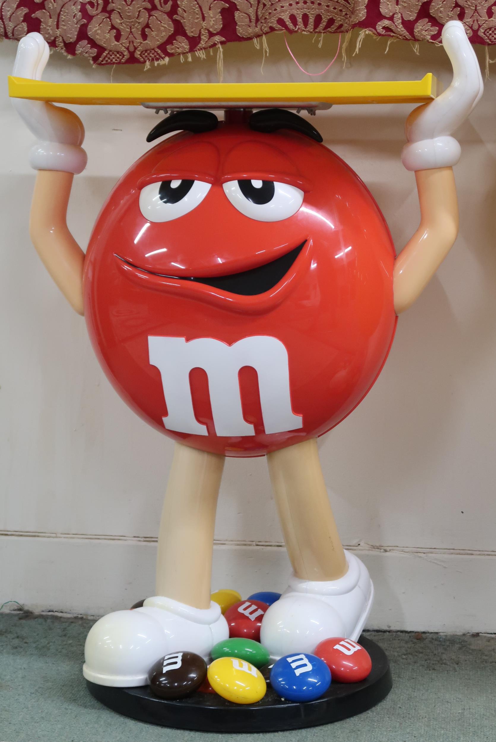 A lot comprising mixed pair of Mars M&M red and yellow advertising standees holding fixed serving - Image 3 of 3