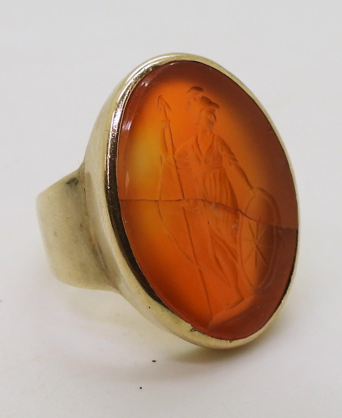 A bright yellow metal signet ring set with a large carnelian intaglio carved with Brittania ( - Image 4 of 6