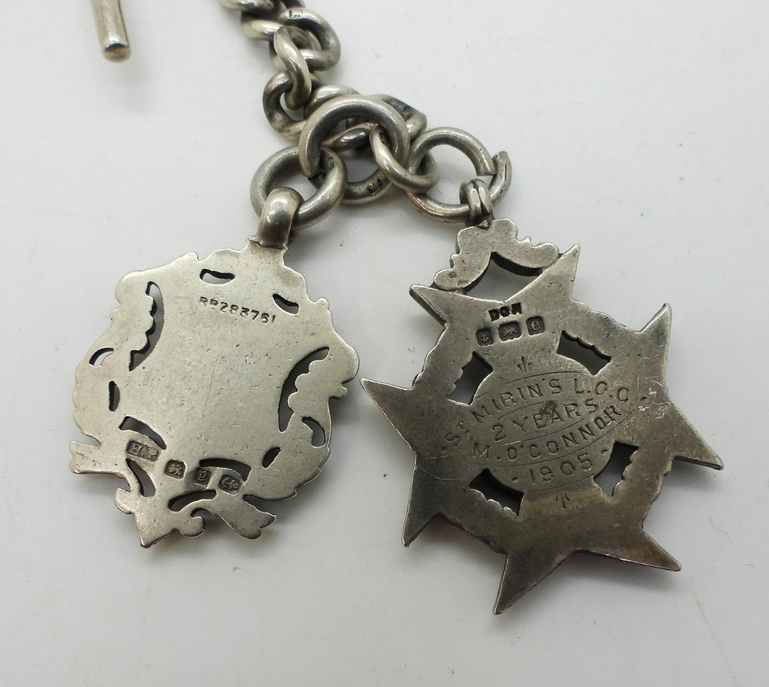 A heavy silver tapered fob chain with two silver medallions, hallmarked to every link, tapers from - Image 2 of 2