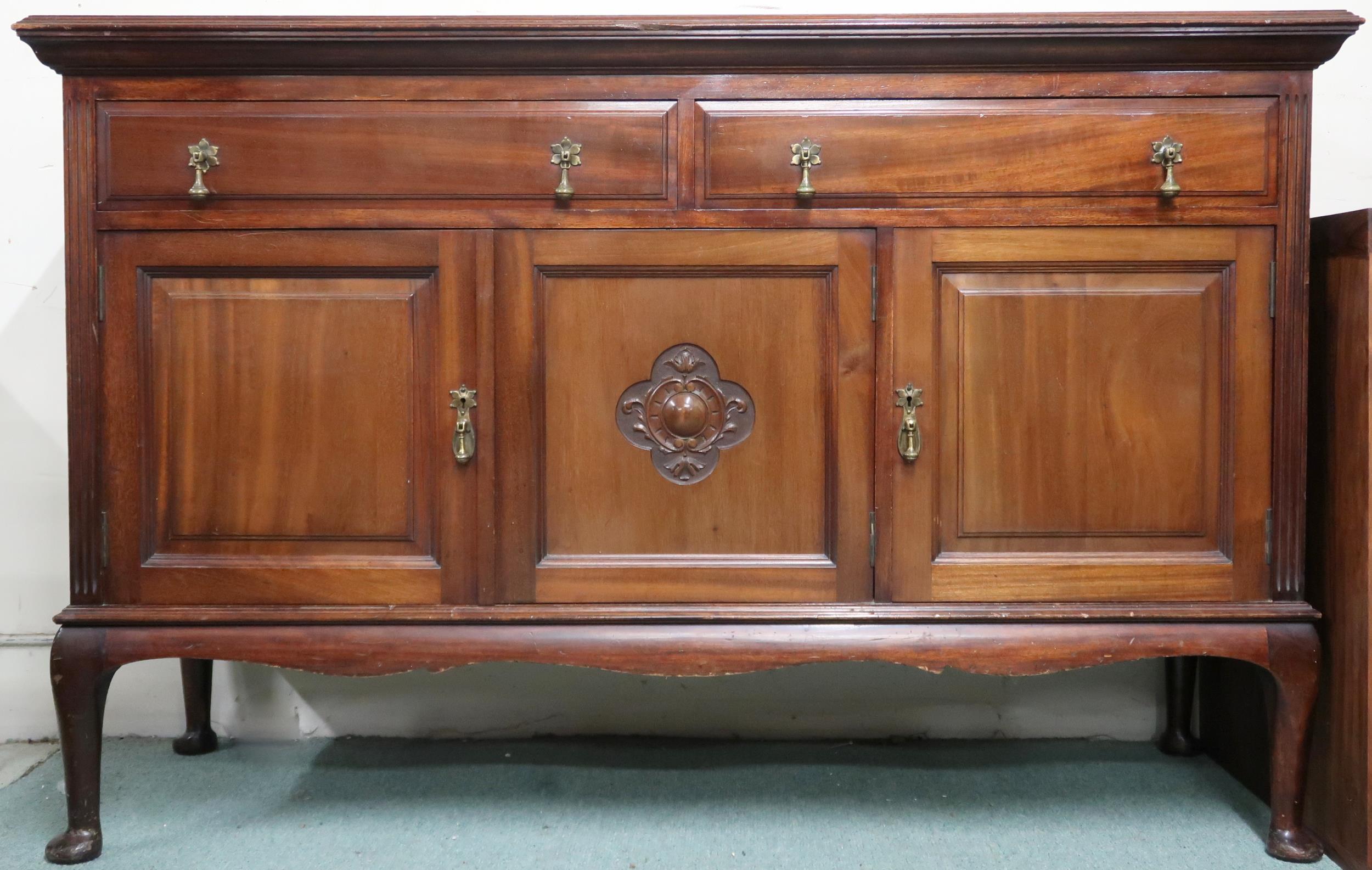 An early 20th century mahogany sideboard with two long drawers over three cabinet doors on Queen
