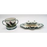 A Wemyss ware black cockerel and hens double inkwell 26cm wide, together with a tyg, 10cm high (2)