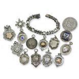 Twelve silver medallions to include a Scotland's Defence Lodge with eagle surmount, Edinburgh and