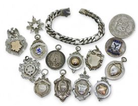 Twelve silver medallions to include a Scotland's Defence Lodge with eagle surmount, Edinburgh and