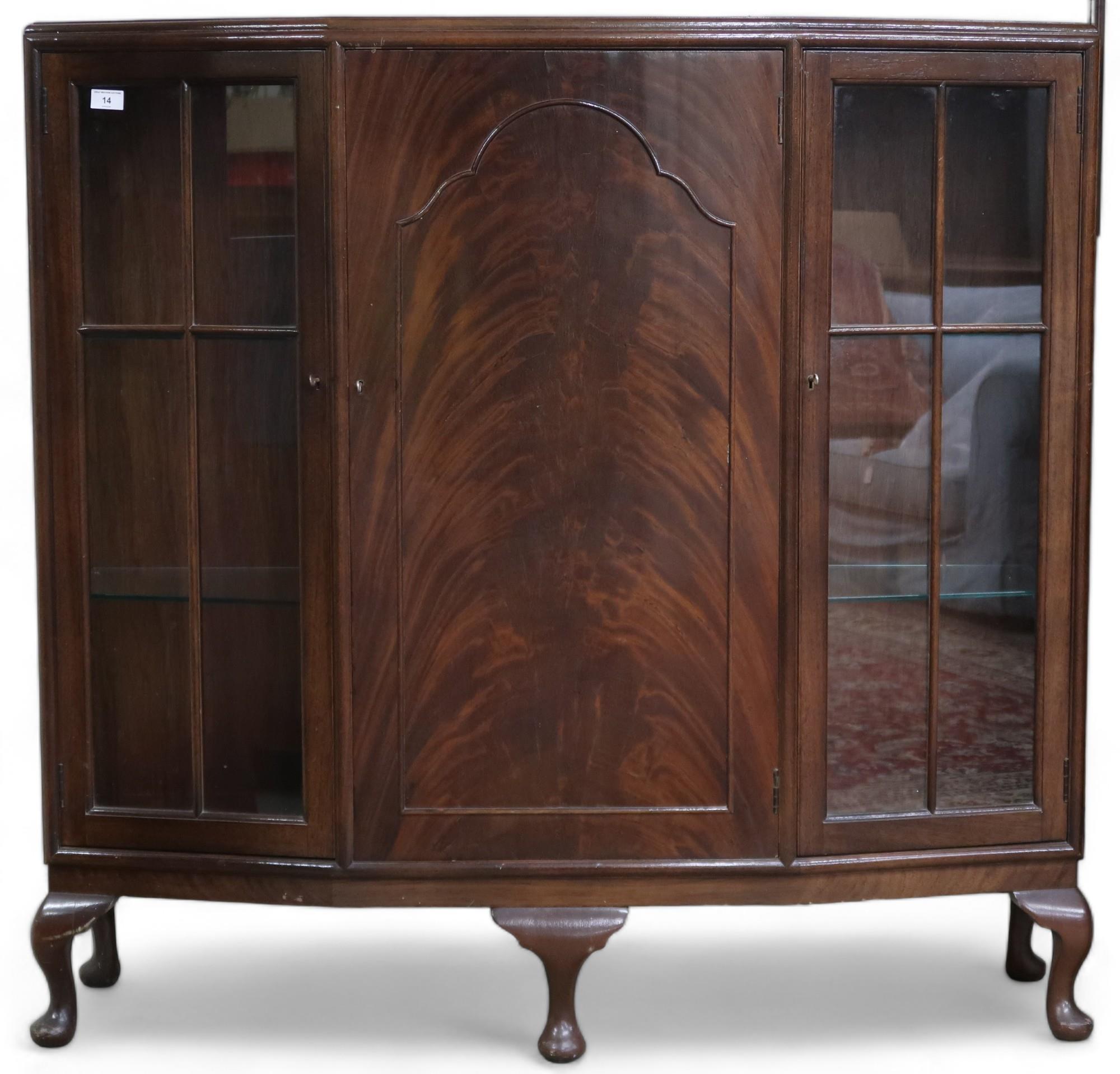 An early 20th century mahogany display cabinet with central cabinet door flanked by glazed doors