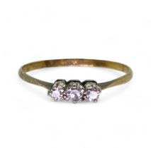 An 18ct gold and platinum three stone diamond ring, set with estimated approx 0.10cts of eight cut