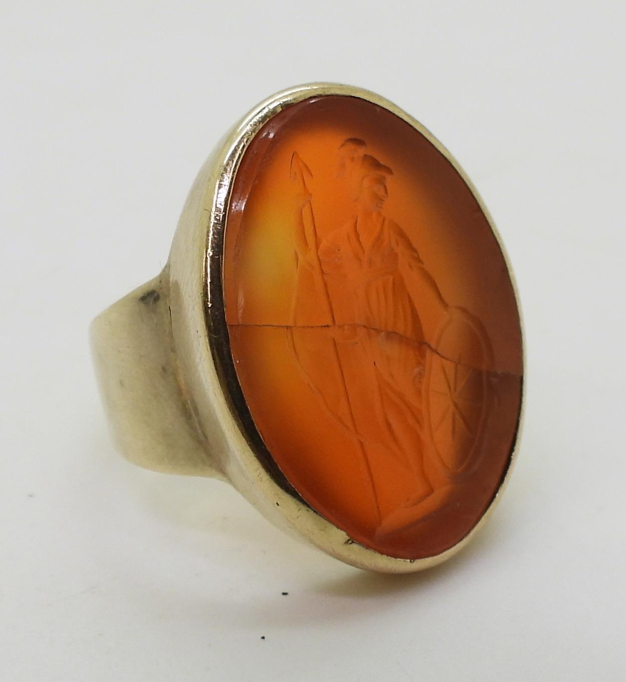 A bright yellow metal signet ring set with a large carnelian intaglio carved with Brittania ( - Image 3 of 6