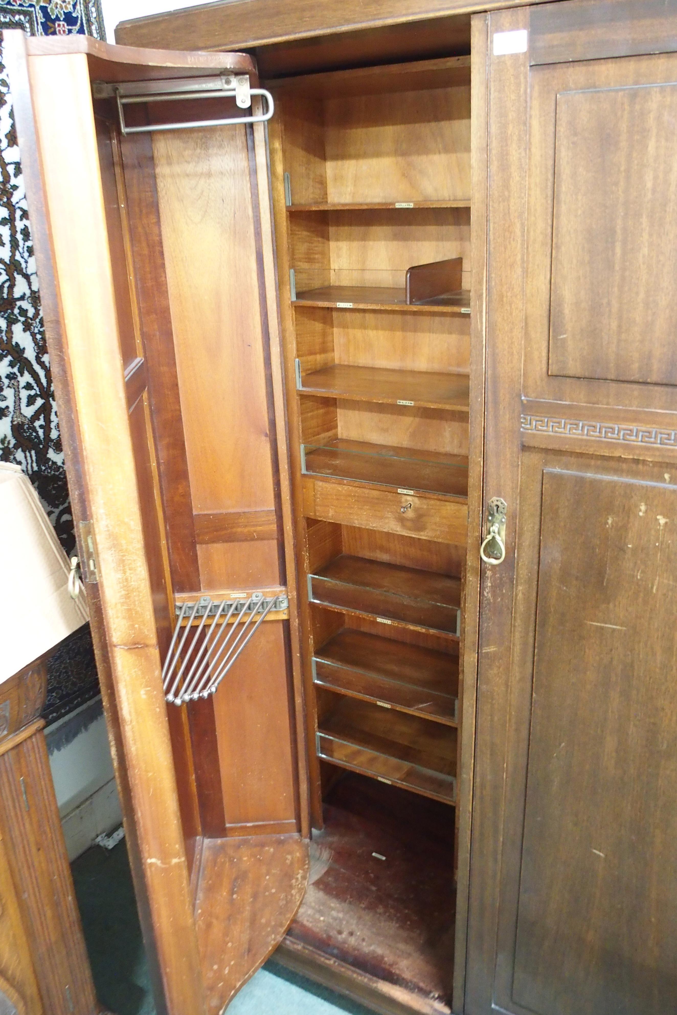 An early 20th century mahogany compactum wardrobe with pair of doors carved with Grecian key - Image 2 of 3