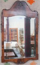 A 20th century walnut framed bevelled glass wall mirror, 77cm high x 48cm wide Condition Report: