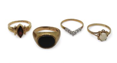 Four 9ct gold rings, onyx signet ring size P, cz 'V' shaped ring size N1/2, opal ring size M1/2, and