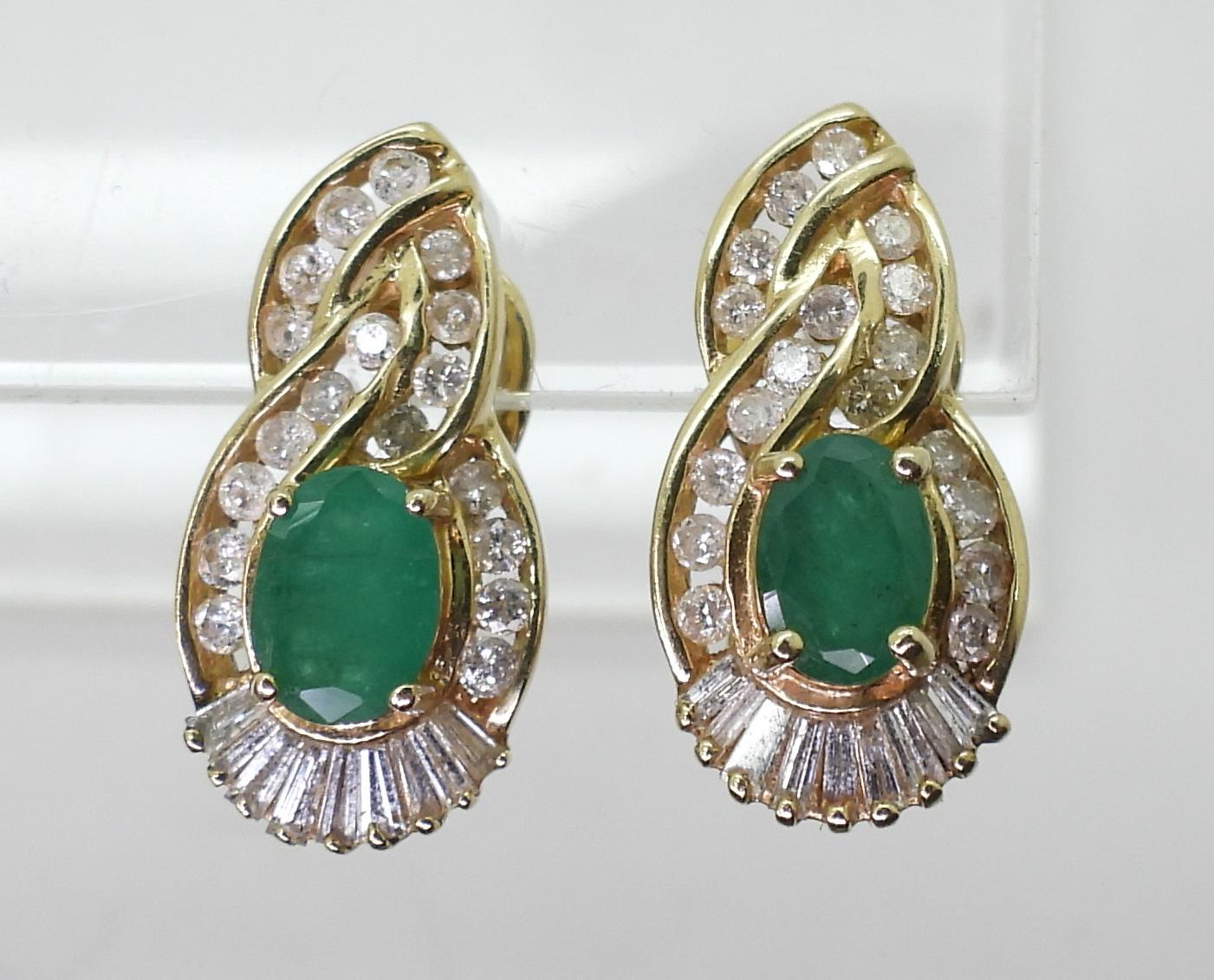 A pair of 14k gold emerald and diamond earrings set with estimated approx 0.50cts of brilliant and - Image 2 of 3